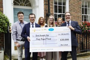 UK- Merkur celebrate fantastic support for bacta Charitable Trust with a smile