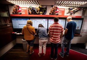 UK – Racing Post and Ladbrokes launch first paperless betting shops