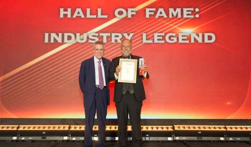 Dennis Andreaci (left) presents the Industry Legend award to Ken Jolly