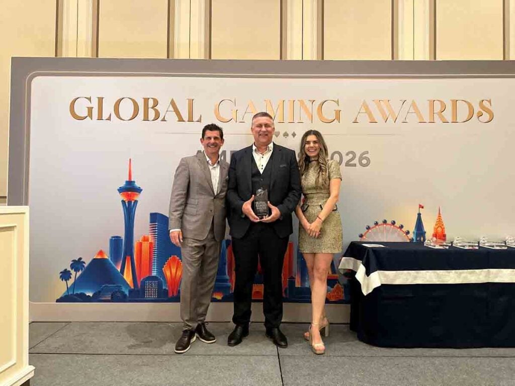 Aristocrat Gaming CEO Craig Toner, center, accepts the award for Class 3 Land-based Supplier of the Year
